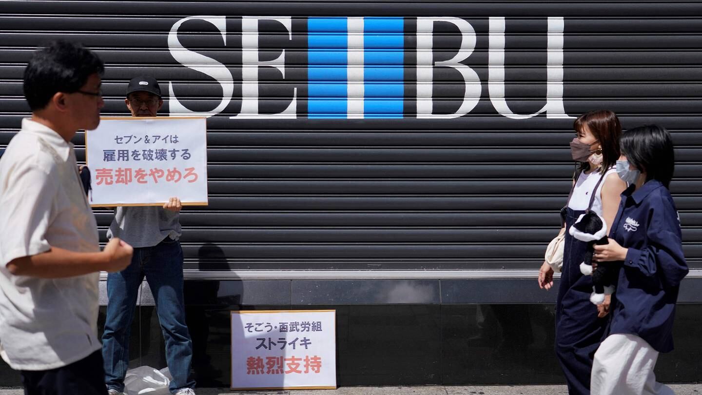 Union members participate in a strike outside a temporarily closed Seibu department store in Tokyo, Japan, on Aug. 31, 2023.