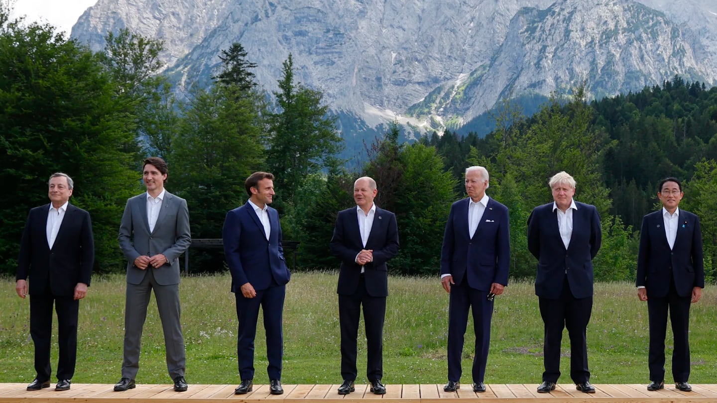 (L-R) Italy's Prime Minister Mario Draghi, Canada's Prime Minister Justin Trudeau, France's President Emmanuel Macron, Germany's Chancellor Olaf Scholz, US President Joe Biden, Britain's Prime Minister Boris Johnson and Japan's Prime Minister Fumio Kishida pose for a family photo during the G7 Summit.