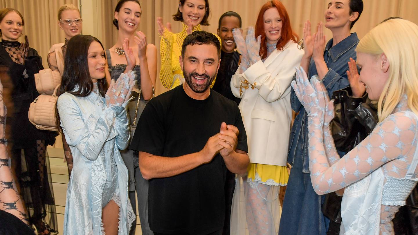 Models applaud Riccardo Tisci following the designer’s spring show for Burberry.