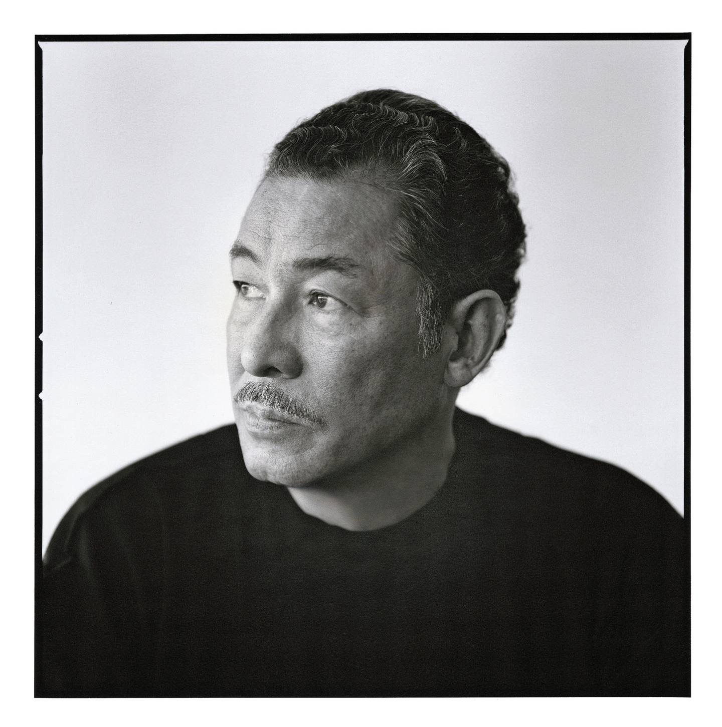Black and white portrait of Issey Miyake