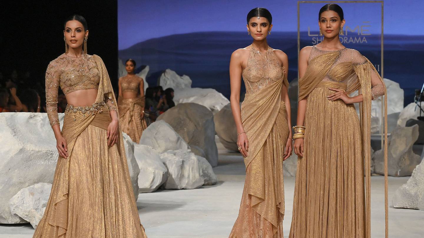 Models presenting creations by designer Tarun Tahiliani during the Lakmé Fashion Week x FDCI, in Mumbai.