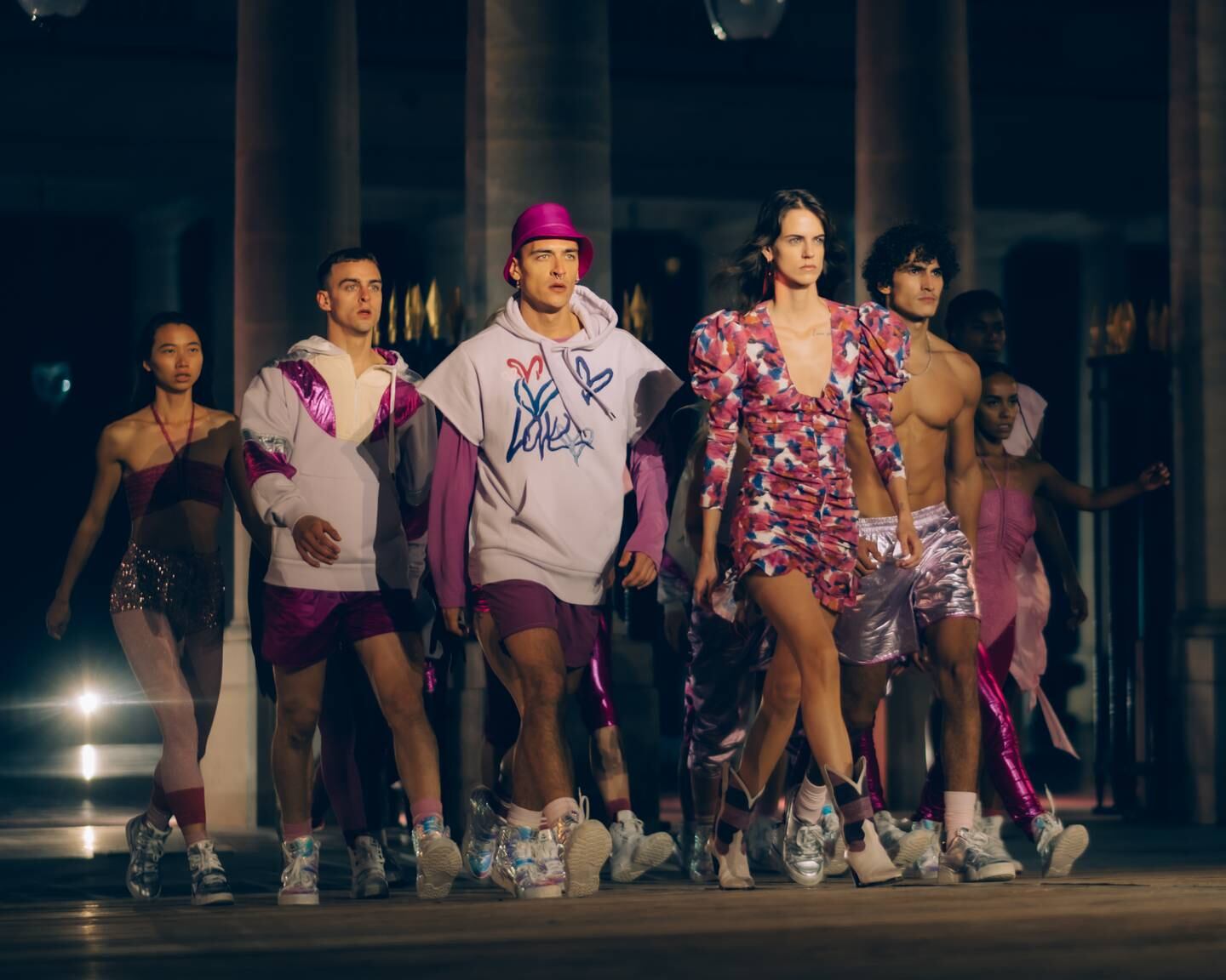 Models walk the runway alongside dancers from France's "La Horde" dance troupe in October 2020.