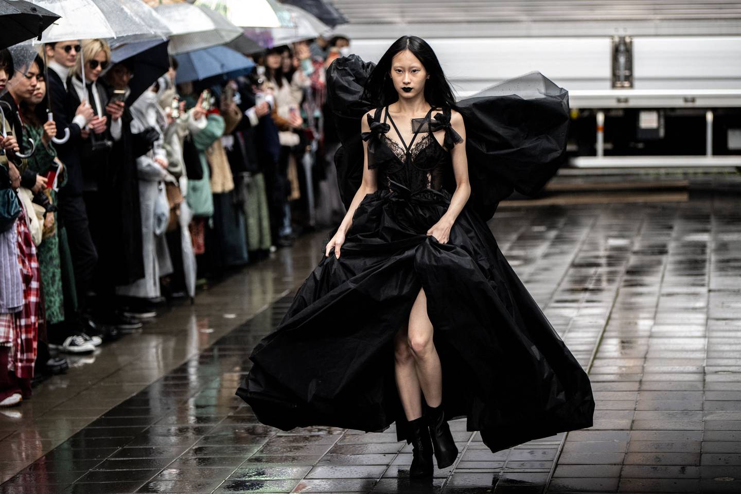 A model displays a creation from the SAYAKAASANO and aki masuda 2023 A/W collection by designers Sayaka Asano and Aki Masuda at the Tokyo Fashion Week.