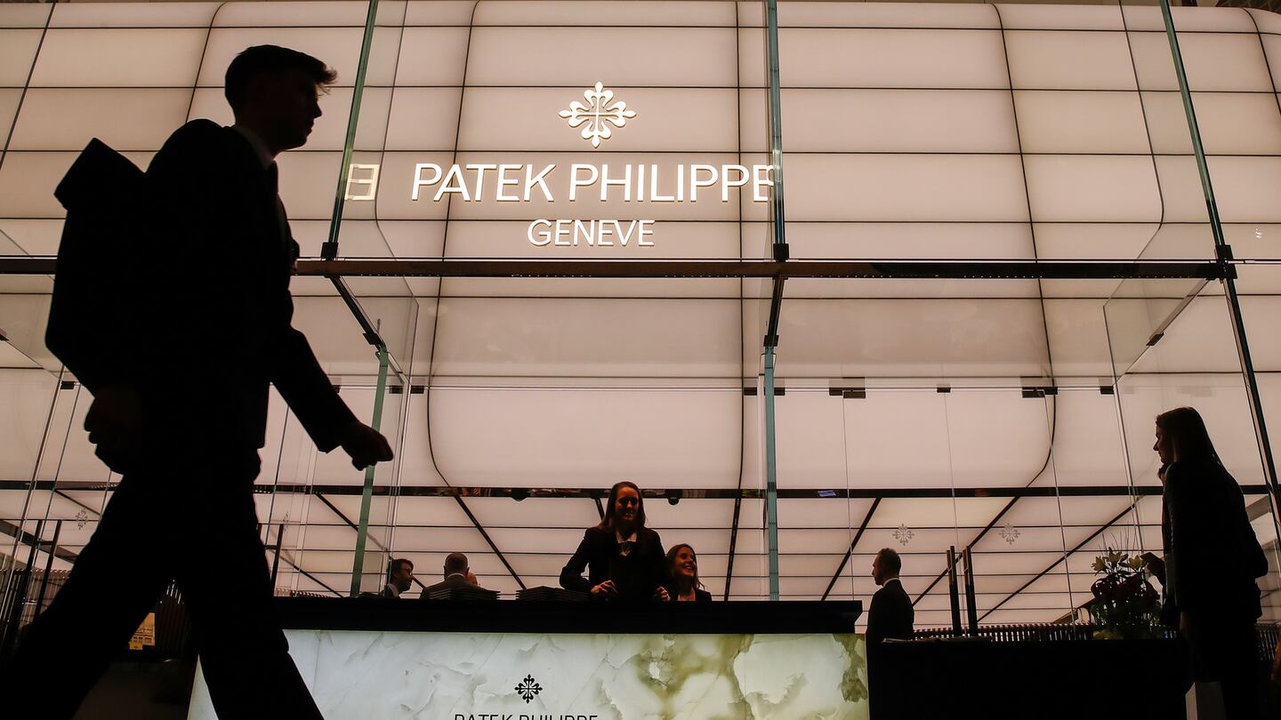 A visitor walks past a Patek Philippe SA booth during day two of the 2019 Baselworld luxury watch and jewellery fair in Basel, Switzerland. Getty Images.