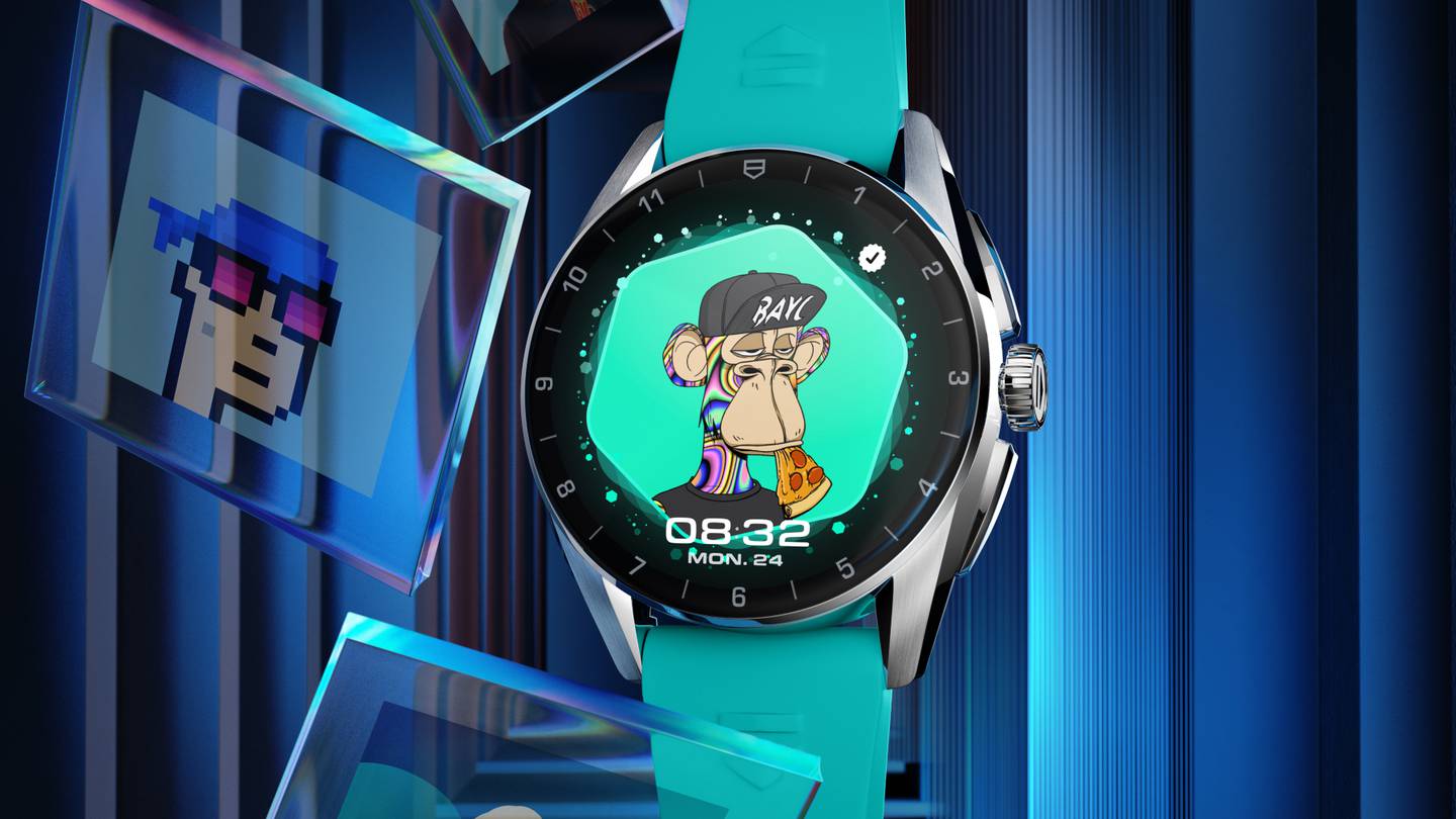 A Tag Heuer watch displays as its face a Bored Ape Yacht Club NFT featuring an ape in a ball cap with a slice of pizza hanging out of its mouth.