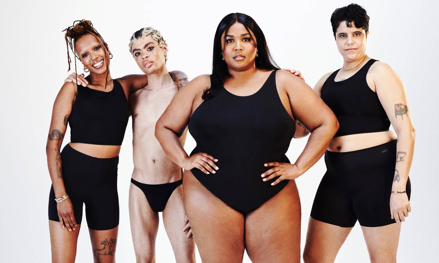 Lizzo poses with models for forthcoming campaign.
