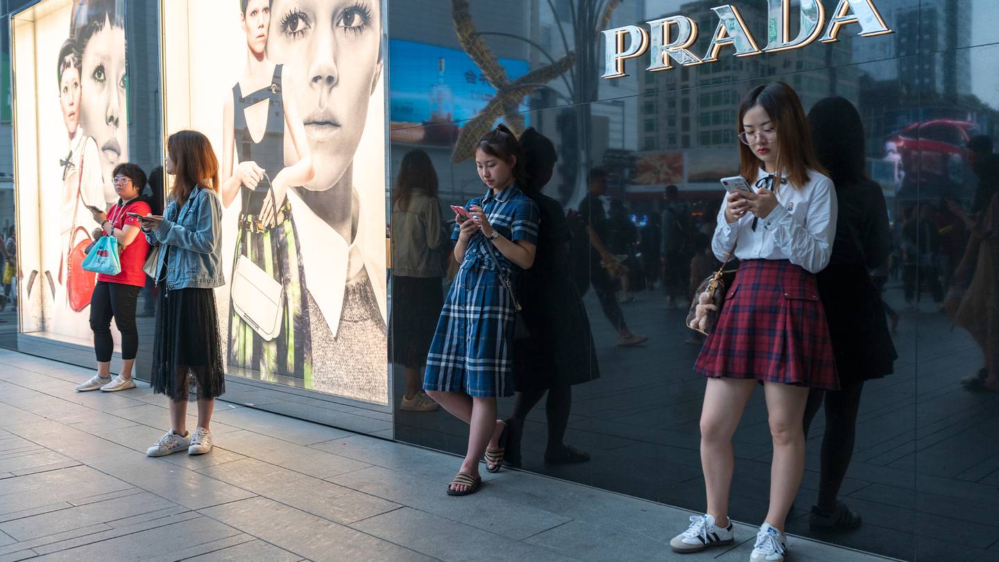 Luxury shoppers in China outside a Prada store.