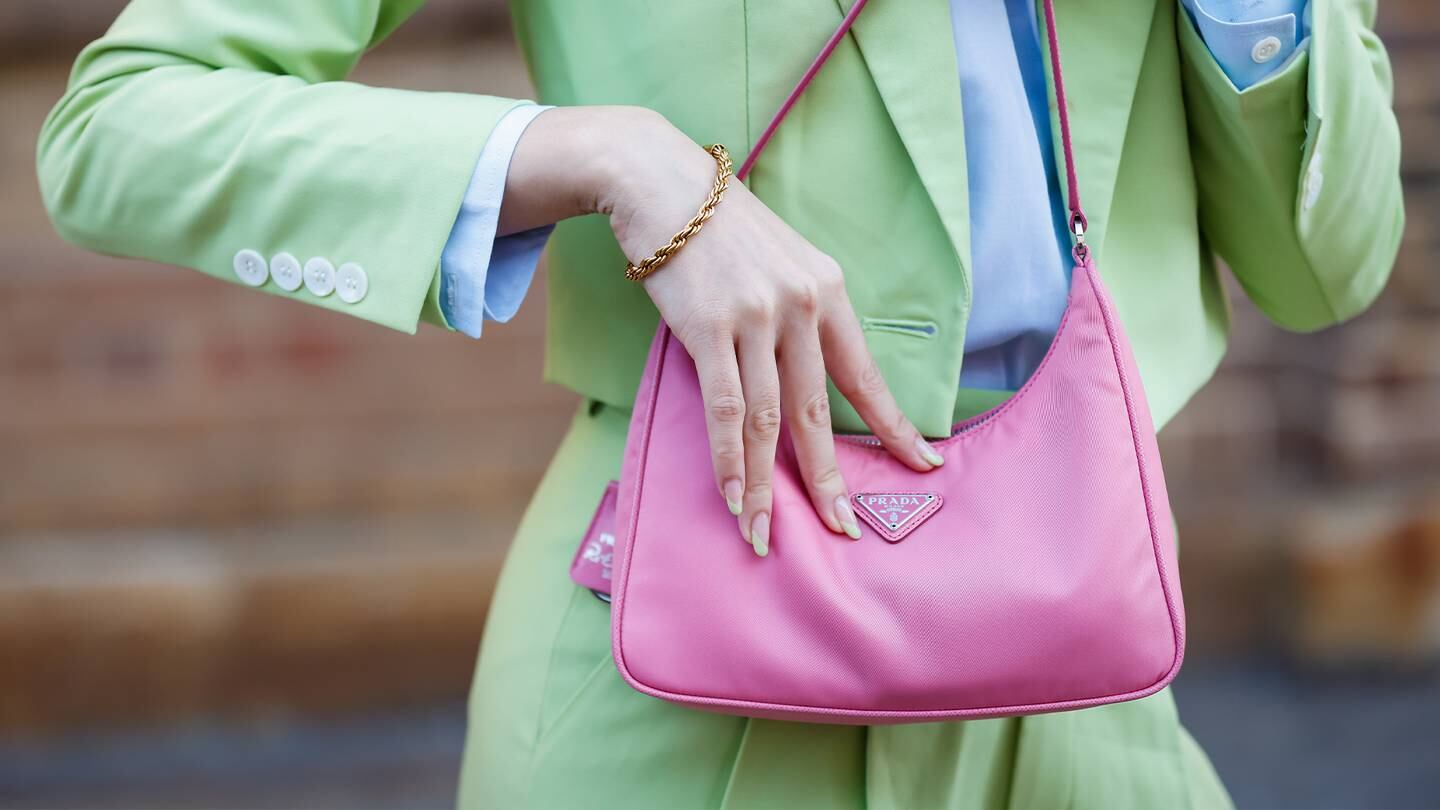 A woman with a Prada pink nylon bag at Afterpay Australian Fashion Week 2021 in Sydney, Australia. Getty Images.