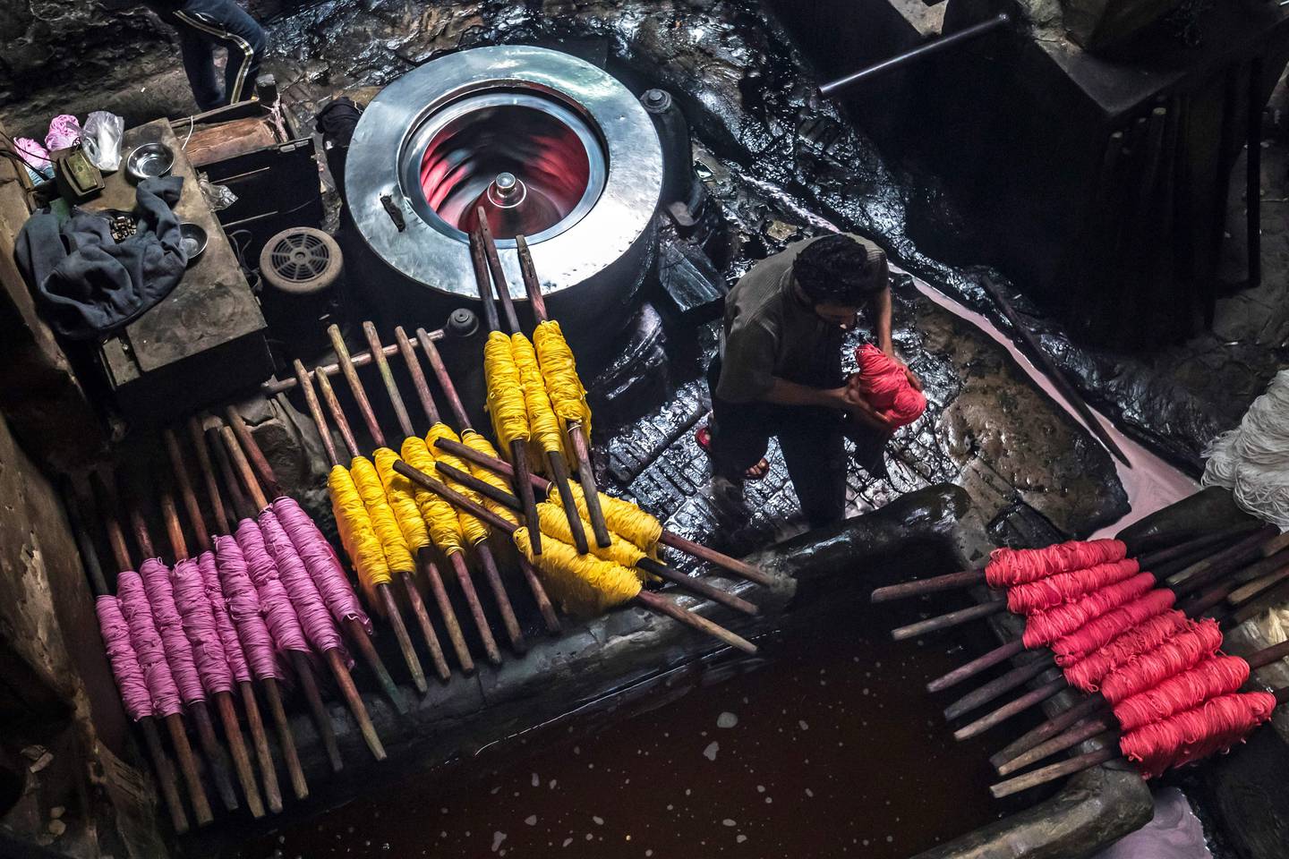 Workers dye yarns at a traditional hand-dying workshop in Cairo, Egypt.