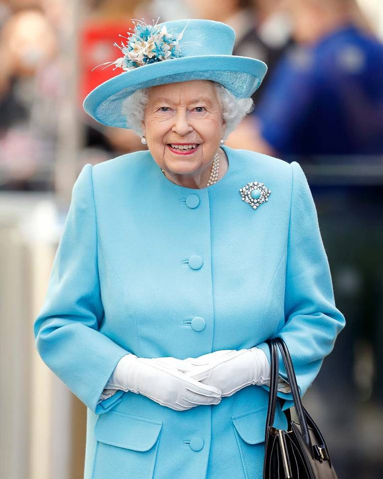 Queen Elizabeth with her signature black Launer handbag