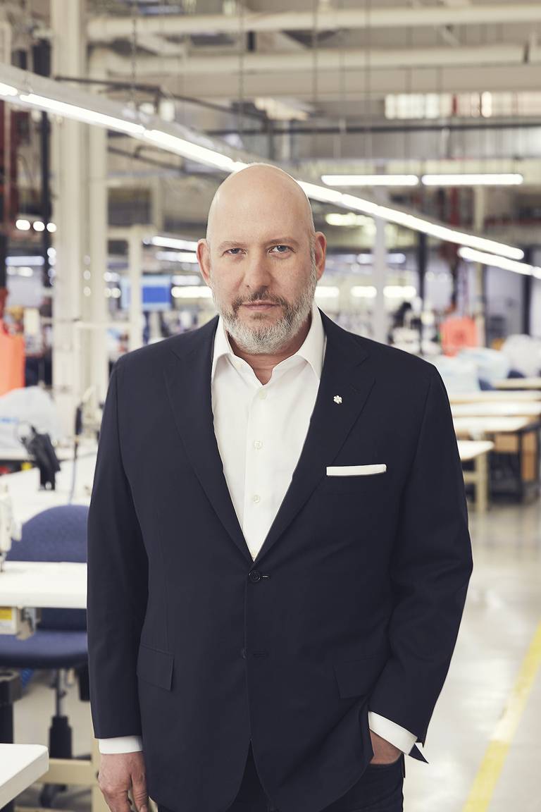Chairman and CEO of Canada Goose, Dani Reiss, standing in one of the brand's manufacturing facilities in Canada.