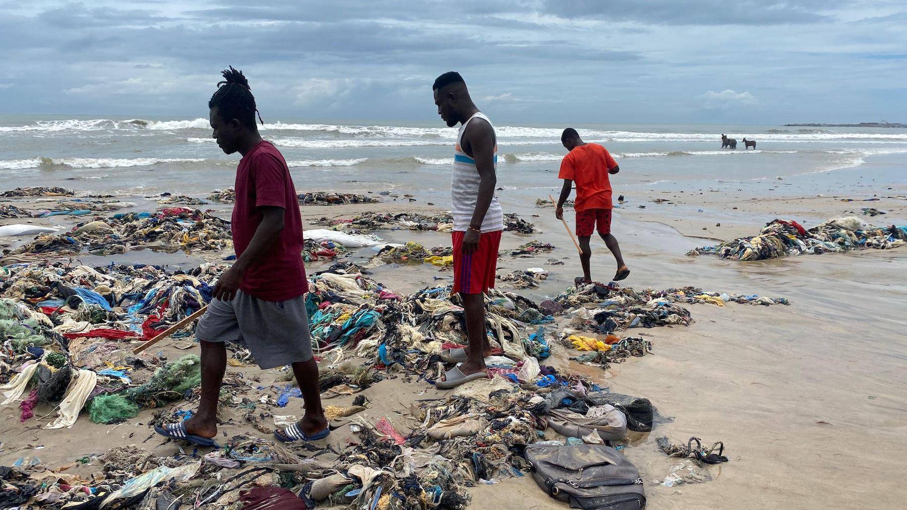 The Or Foundation’s beach monitoring team trawls through tangles of textile waste on a beach in Ghana.