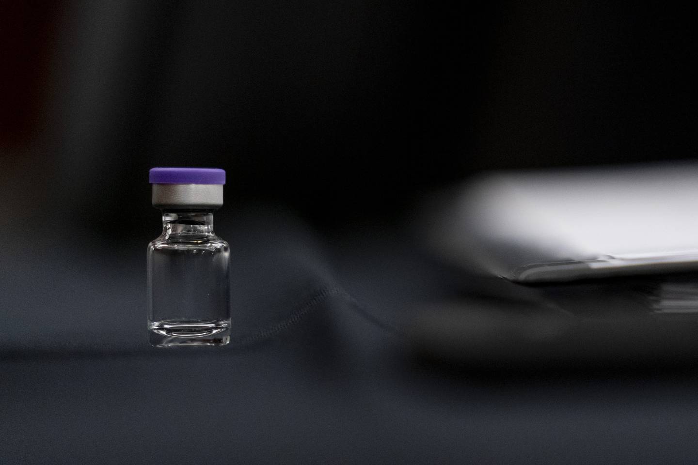 WASHINGTON, DC - DECEMBER 10: An example of the Pfizer COVID-19 vaccine vial is visible on a desk before a Senate Transportation subcommittee hybrid hearing on transporting a coronavirus vaccine on Capitol Hill, on December 10, 2020 in Washington, DC. (Photo by Andrew Harnik-Pool/Getty Images)