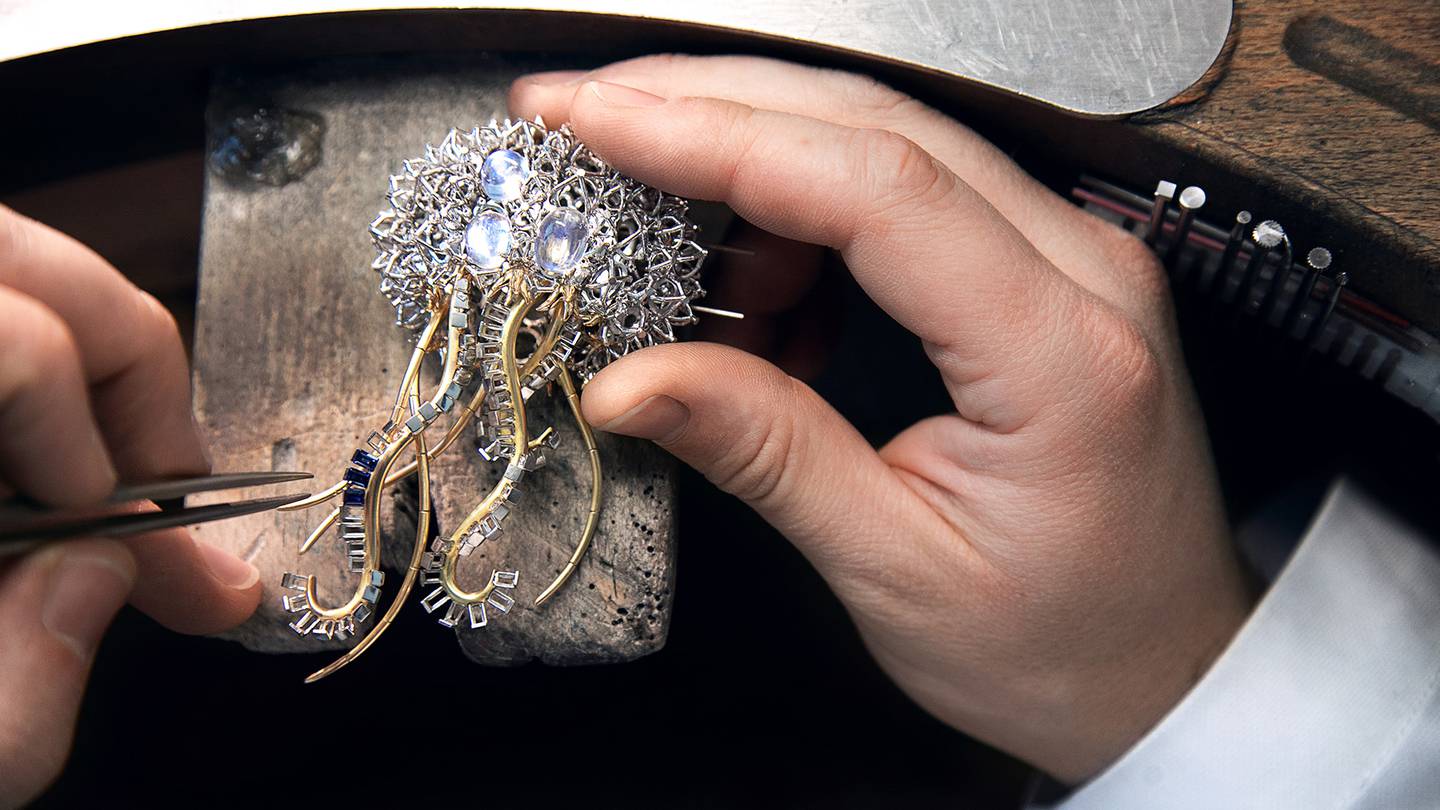 A Tiffany artisan sets sapphires in the tentacles of a high-jewellery jellyfish brooch.