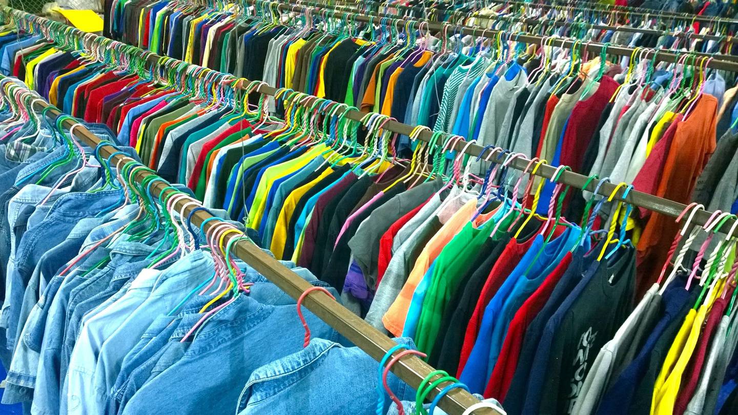 Racks of clothing at a second-hand store.