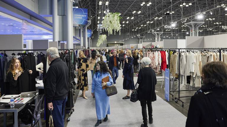 Attendees looking at showcasing brands on the Coterie New York show floor in February.