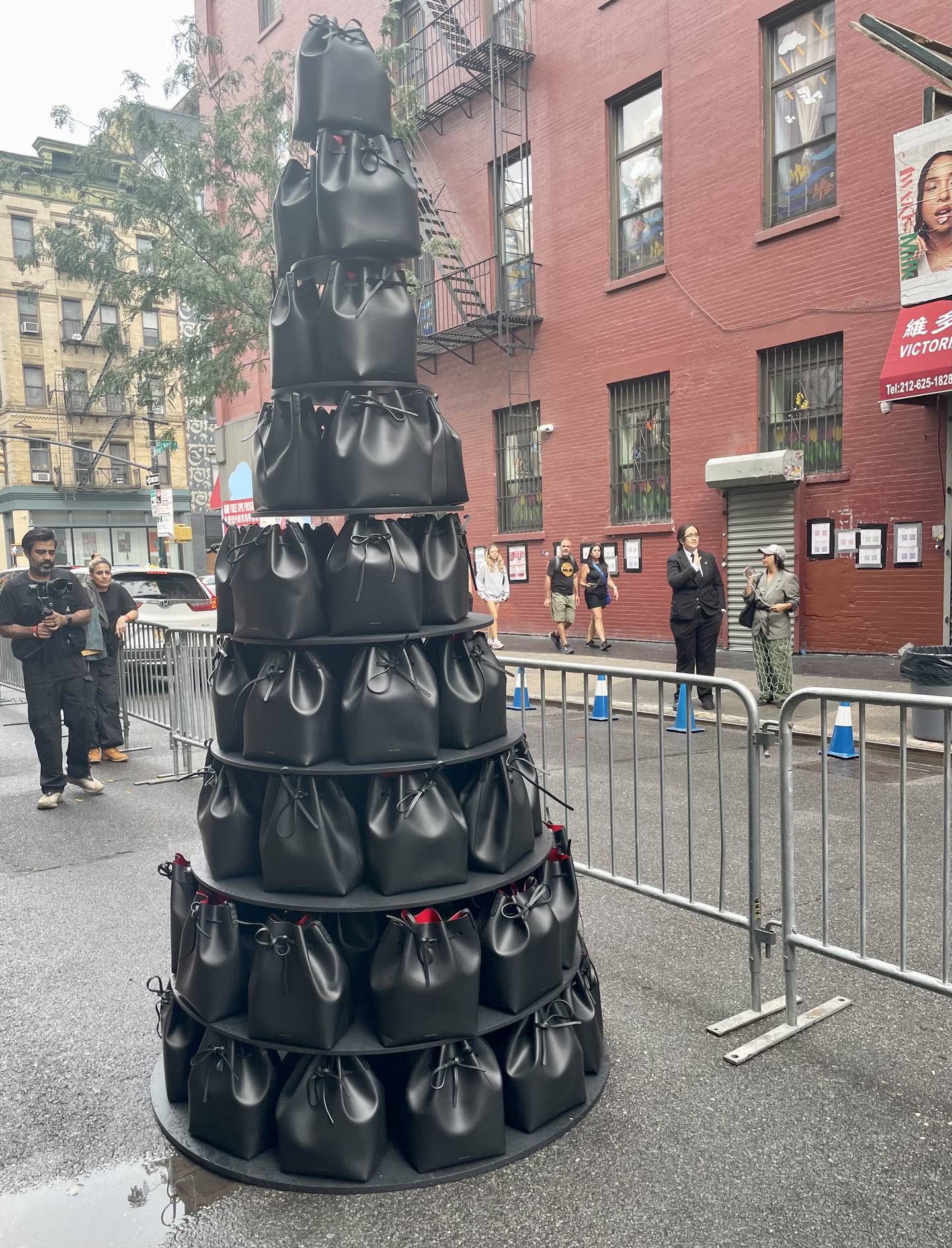A tower made of Mansur Gavriel's signature black bucket bags.
