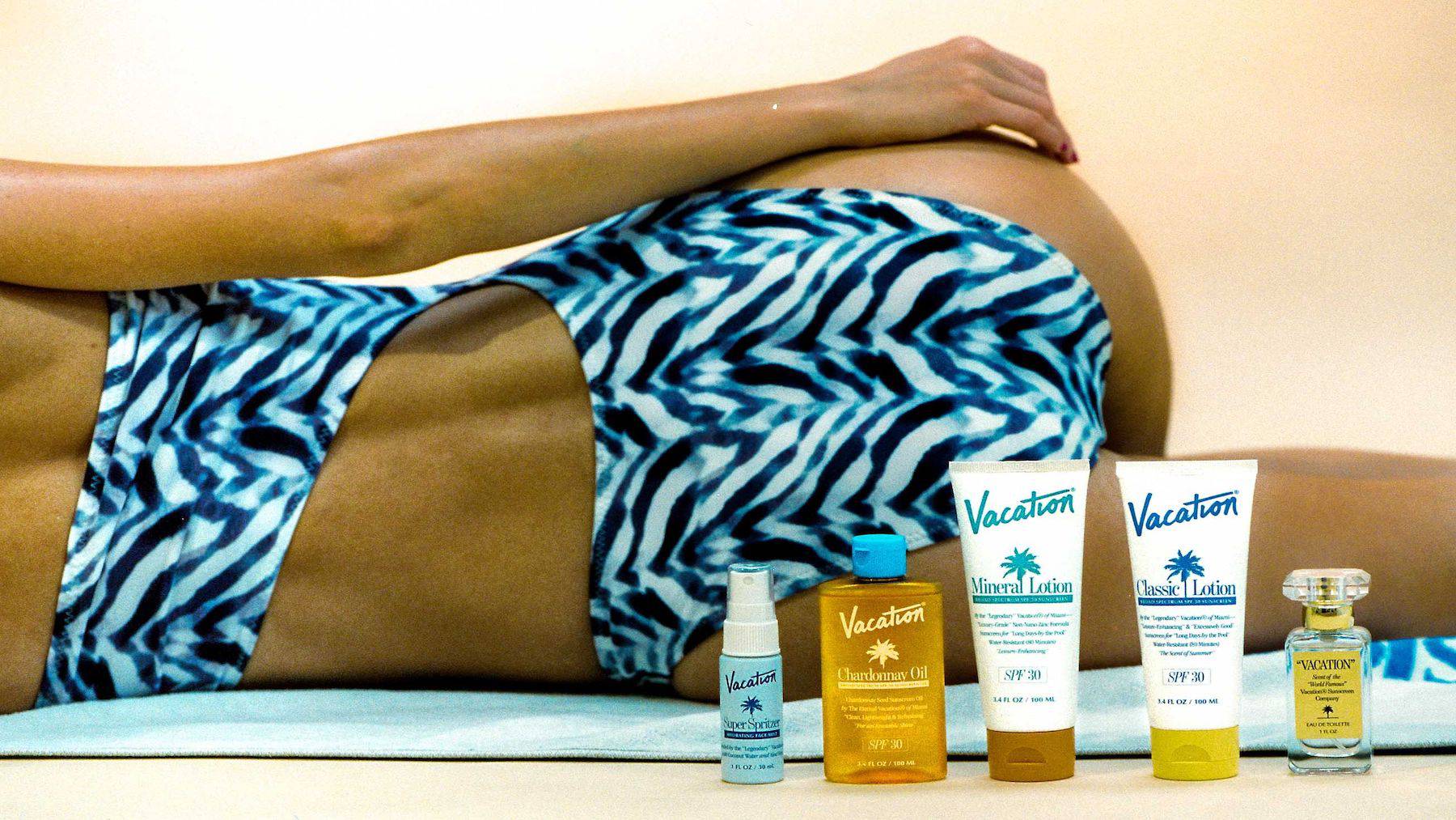 vacation brand sunscreen advertisement model laying down products