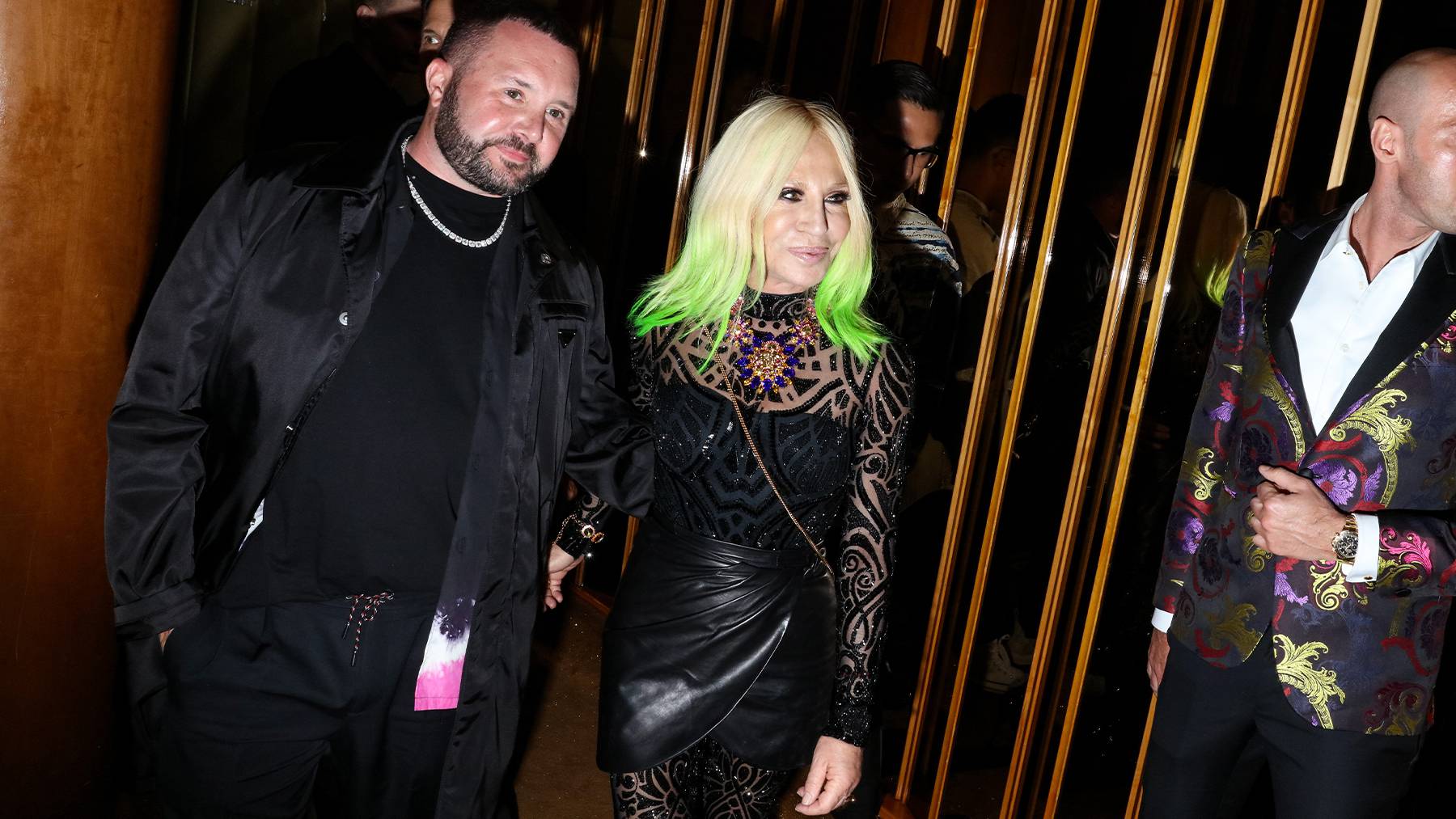 Kim Jones and Donatella Versace arrive at the Met Gala afterparty in 2019.