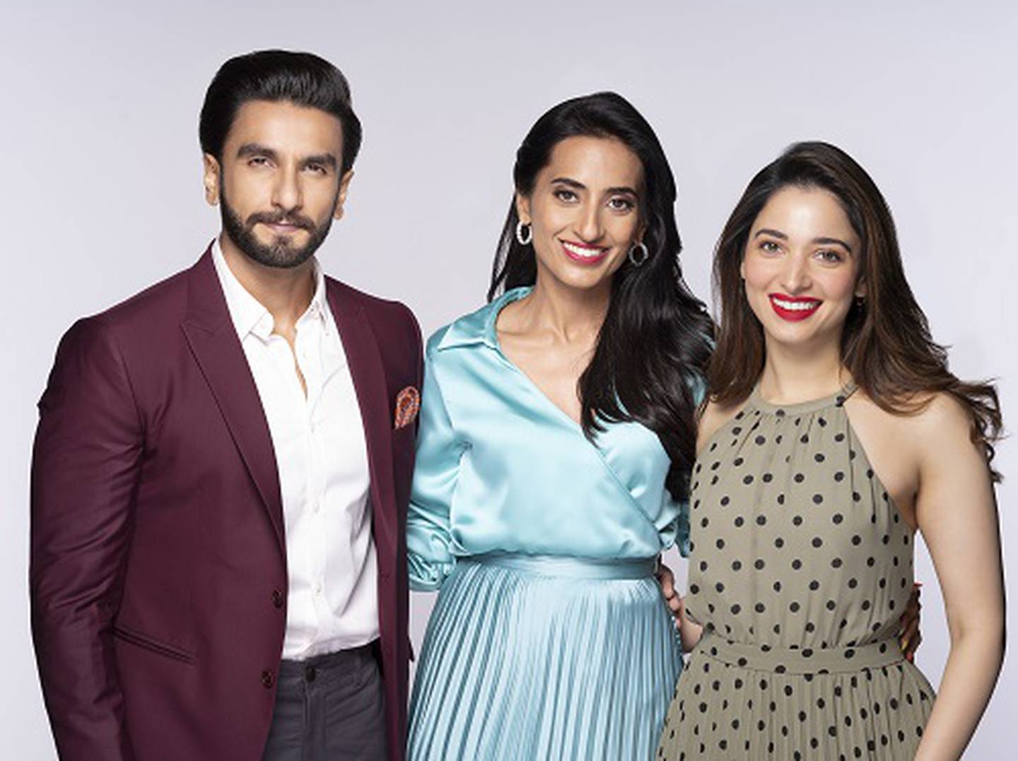Sugar Cosmetics co-founder and CEO Vineeta Singh (C) with Bollywood actors Ranveer Singh (L) and Tamannaah Bhatia (R), who are investors in the company.