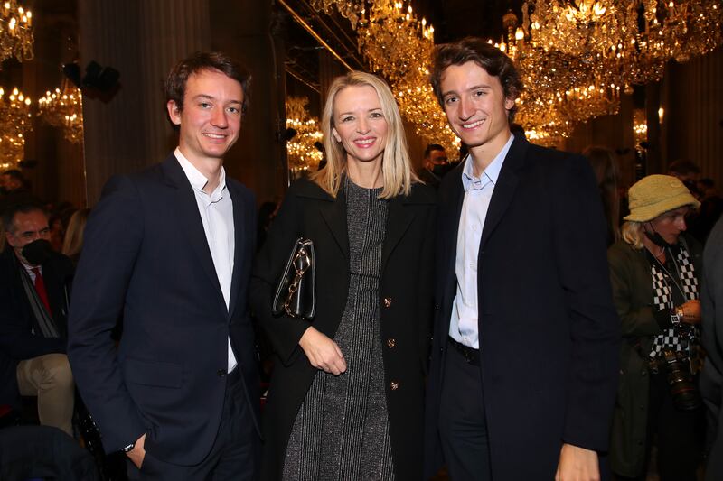Delphine Arnault was photographed with younger brothers Frédéric and Jean at Louis Vuitton's spring-summer 2022 womenswear show in Paris.