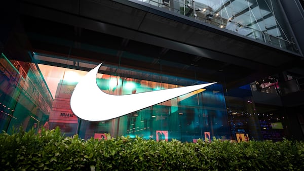 A Nike swoosh on a store front.