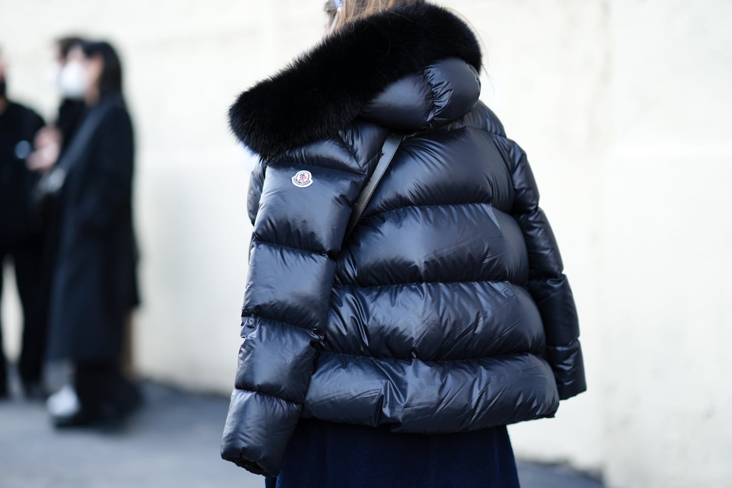 A guest wears a Moncler puffer jacket at Milan Men's Fashion Week on January 15, 2022. Moncler announced in January that it will stop using fur in all products by A/W 2023.