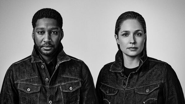 Black-and-white photo of Rushemy Botter and Lisi Herrebrugh wearing matching G-Star Raw denim jackets.