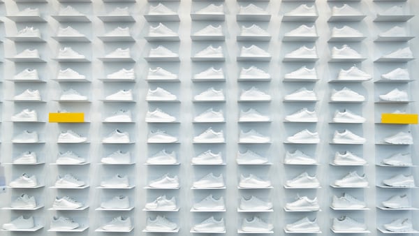 Wall of white sneakers.