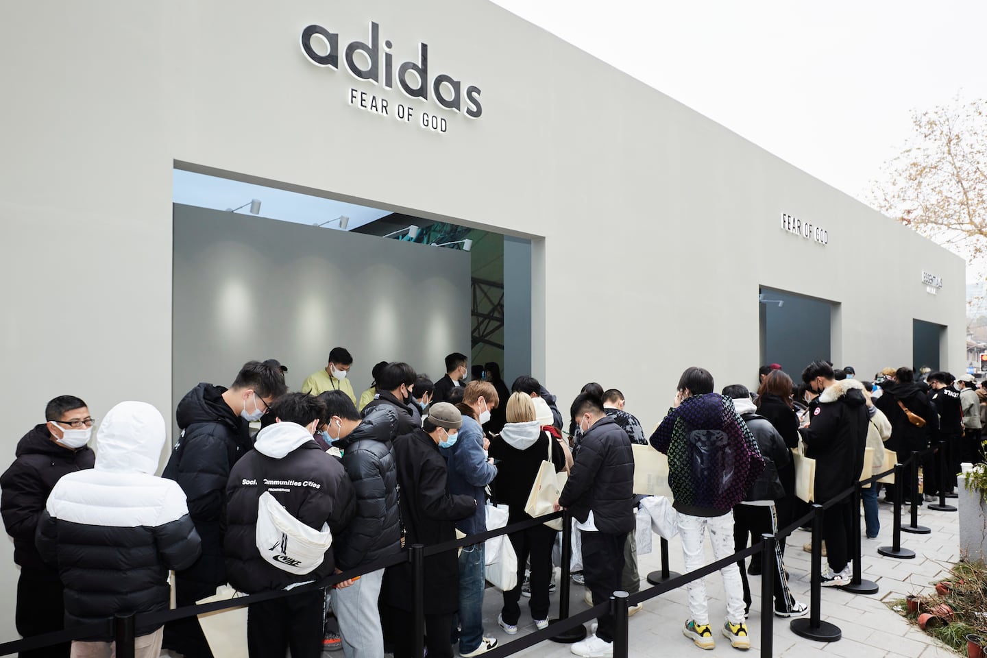 A line forms outside of the Adidas x Fear of God exhibition space at Innersect.