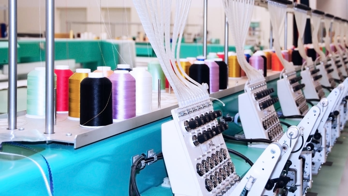 Industrial embroidery machines. Shutterstock. Manufacturing