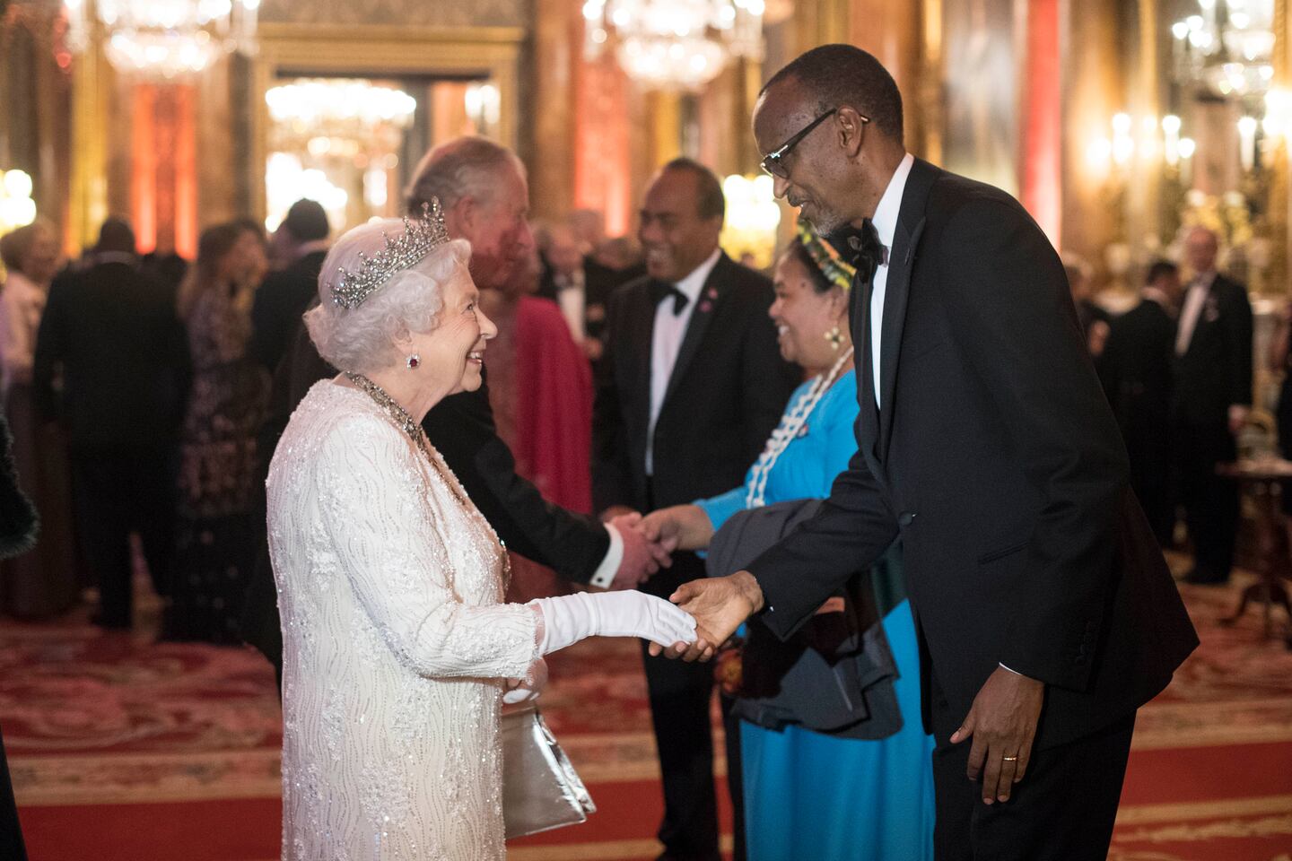 Queen Elizabeth II greets Paul Kagame, President of Rwanda at The Queen's Dinner during the Commonwealth Heads of Government Meeting. Getty Images.