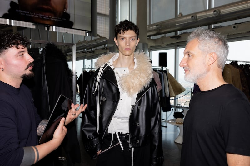 Moncler Group CEO Leo Rongone speaks to designer Domenico Orifice.