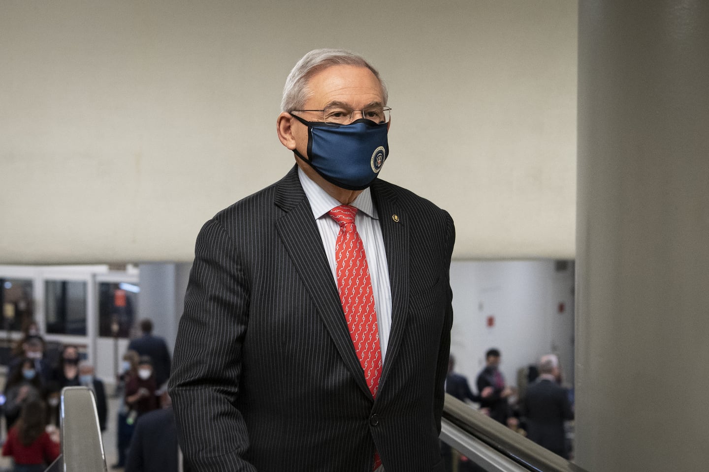 Senator Bob Menendez, a Democrat from New Jersey, walks through the Senate subway at the U.S. Capitol in Washington, D.C., U.S., on Tuesday, Feb. 9, 2021. The Senate begins Donald Trump's second impeachment trial today with a fight over whether the proceeding is constitutional, as a number of conservative lawyers reject the defense teams claim that a former president can't be convicted of a crime by Congress. Photographer: Caroline Brehman/CQ Roll Call/Bloomberg via Getty Images