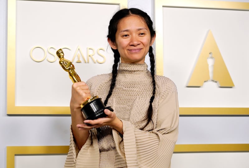 Chloe Zhao poses in the press room at the Oscars on Sunday, April 25, wearing Hermès. Getty.