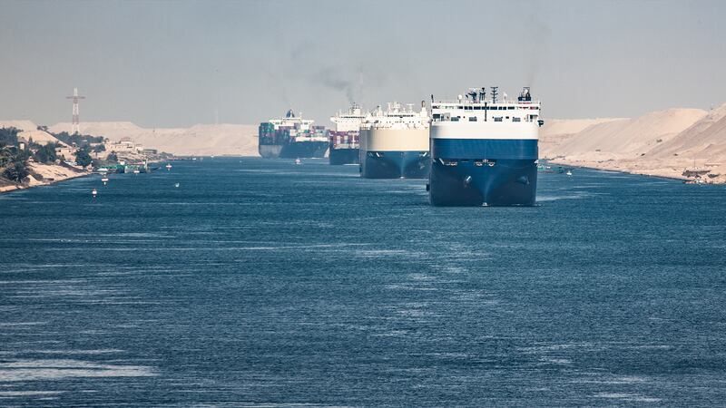 Cargo ships pass through Suez Canal