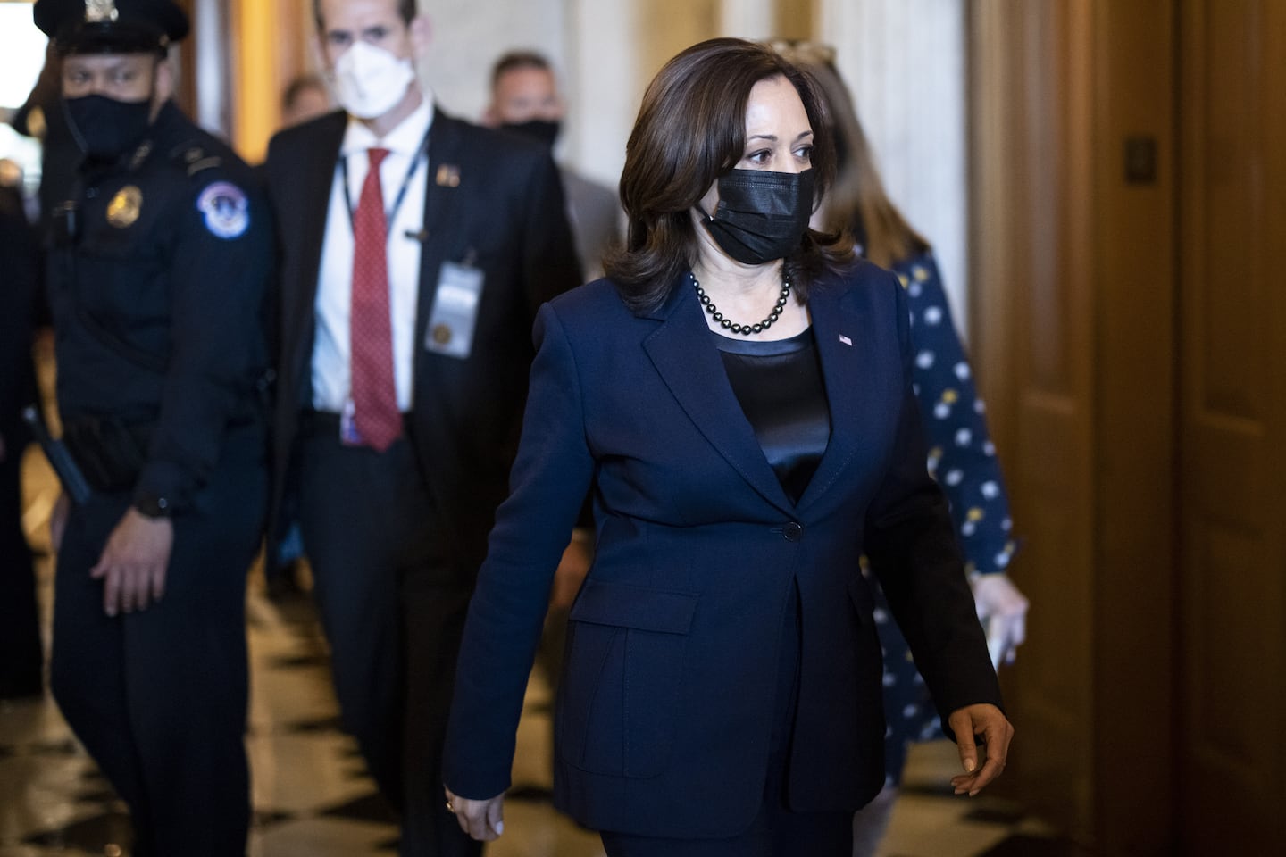 U.S. Vice President Kamala Harris wears a protective mask while walking through the U.S. Capitol in Washington, D.C., U.S. on Thursday, March 4, 2021. Senators enter the final stages of debating Democrats' $1.9 trillion pandemic relief bill today with passage in the chamber likely over the weekend and a security threat looming over the Capitol that prompted the House to wrap up work for the week ahead of schedule. Photographer: Ting Shen/Bloomberg via Getty Images