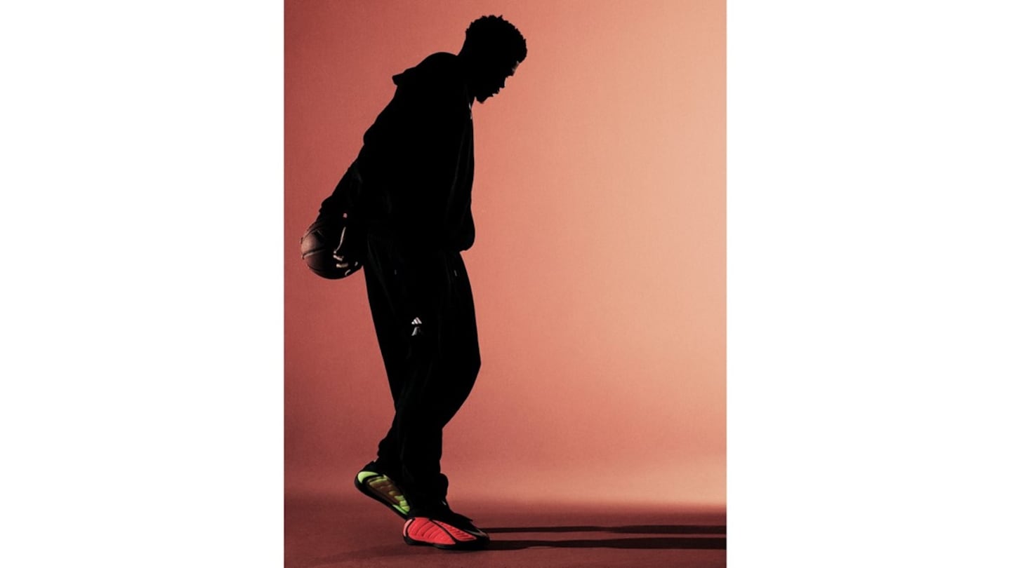 Adidas' star basketball player Anthony Edwards wearing a red and green colorway of his signature AE 2 basketball sneaker