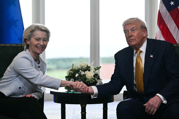US President Donald Trump shakes hands with European Commission President Ursula von der Leyen after agreeing on a trade deal between the two economies.
