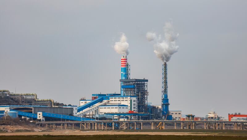 Smokestacks at a chemical plant on the banks of Poyang Lake. Shutterstock.