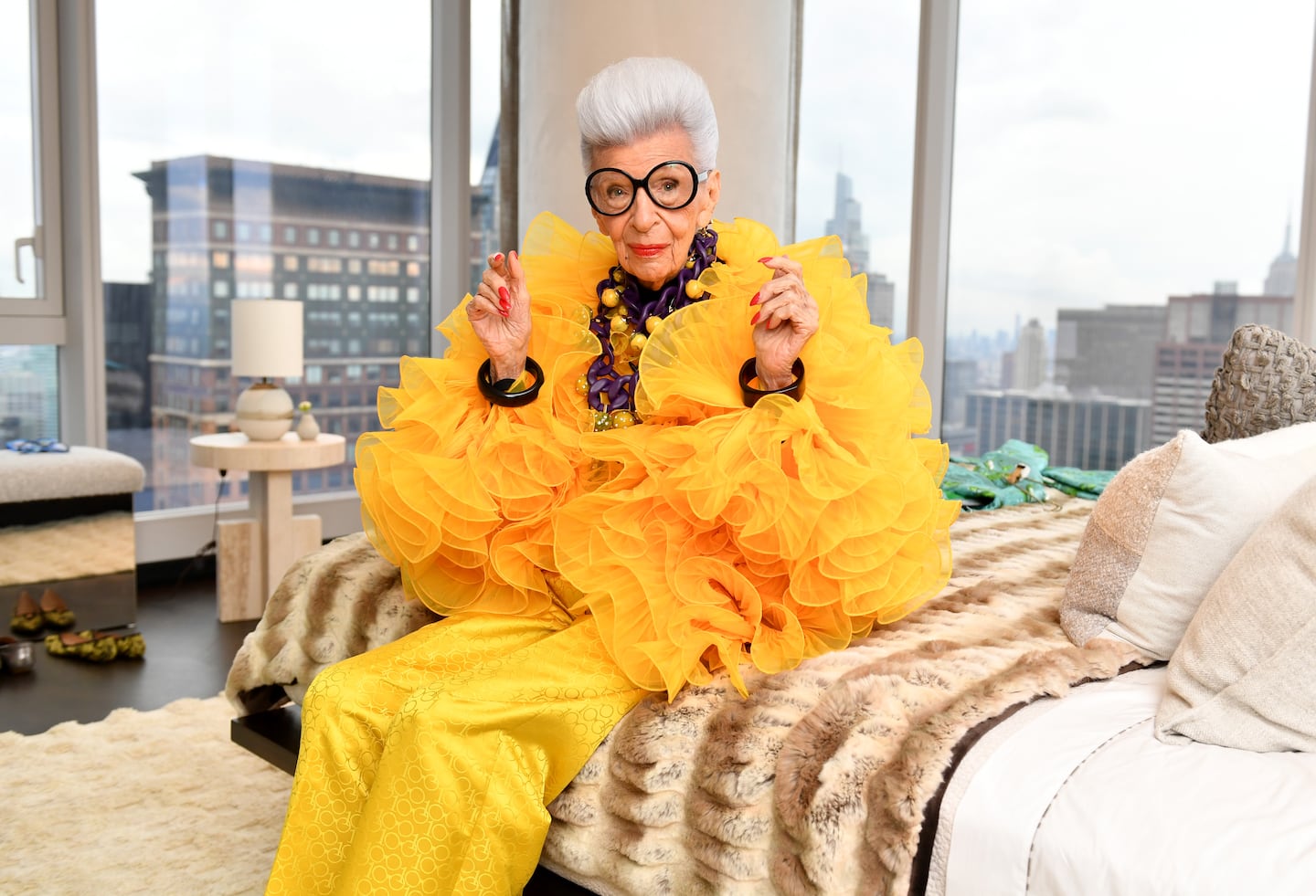 Iris Apfel sits for a portrait during her 100th Birthday Party in New York.