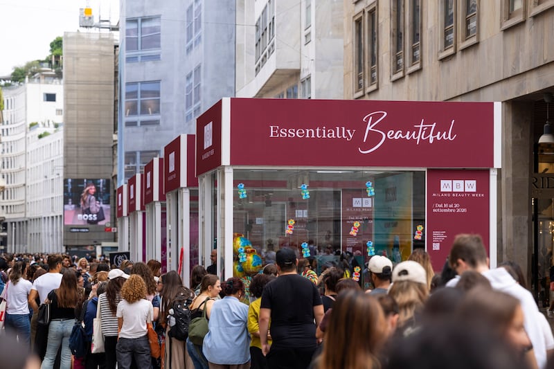 A crowd outside pop-up cubes for Milan Beauty Week