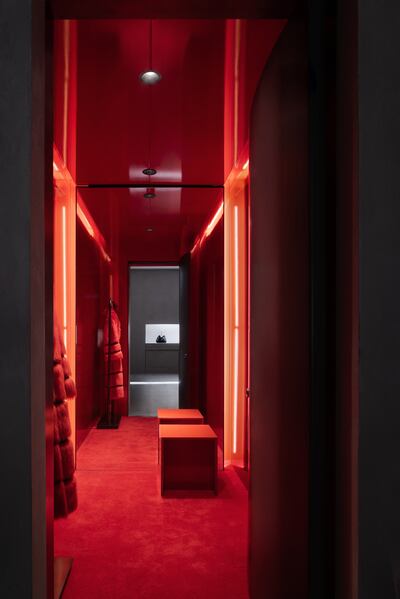 The dressing rooms are done in red to provide a contrast to the rest of the space.
