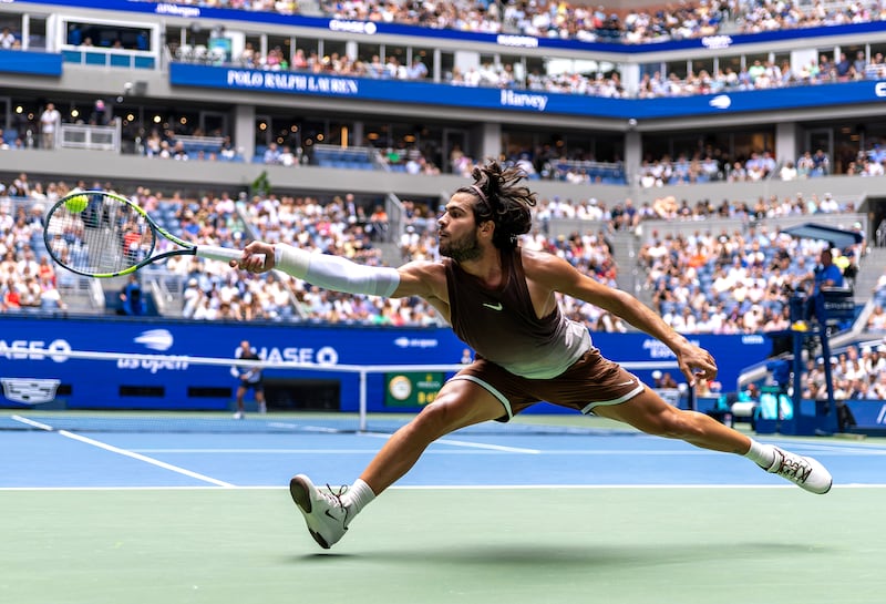Carlos Alcaraz of Spain returns a shot against Roman Safiullin during their Men's Singles First Round match on Day Two of the 2026 US Open on Day Two of the 2026 US Open