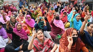 Garment workers stage a demonstration in front of the Department of Labour building in Dhaka, Bangladesh demanding due payment in November.