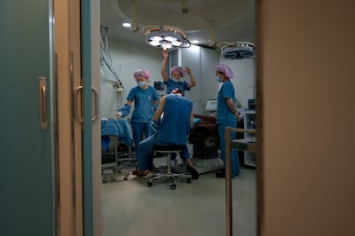 Plastic surgeons at a clinic in Seoul. Ed Jones/AFP via Getty Images.