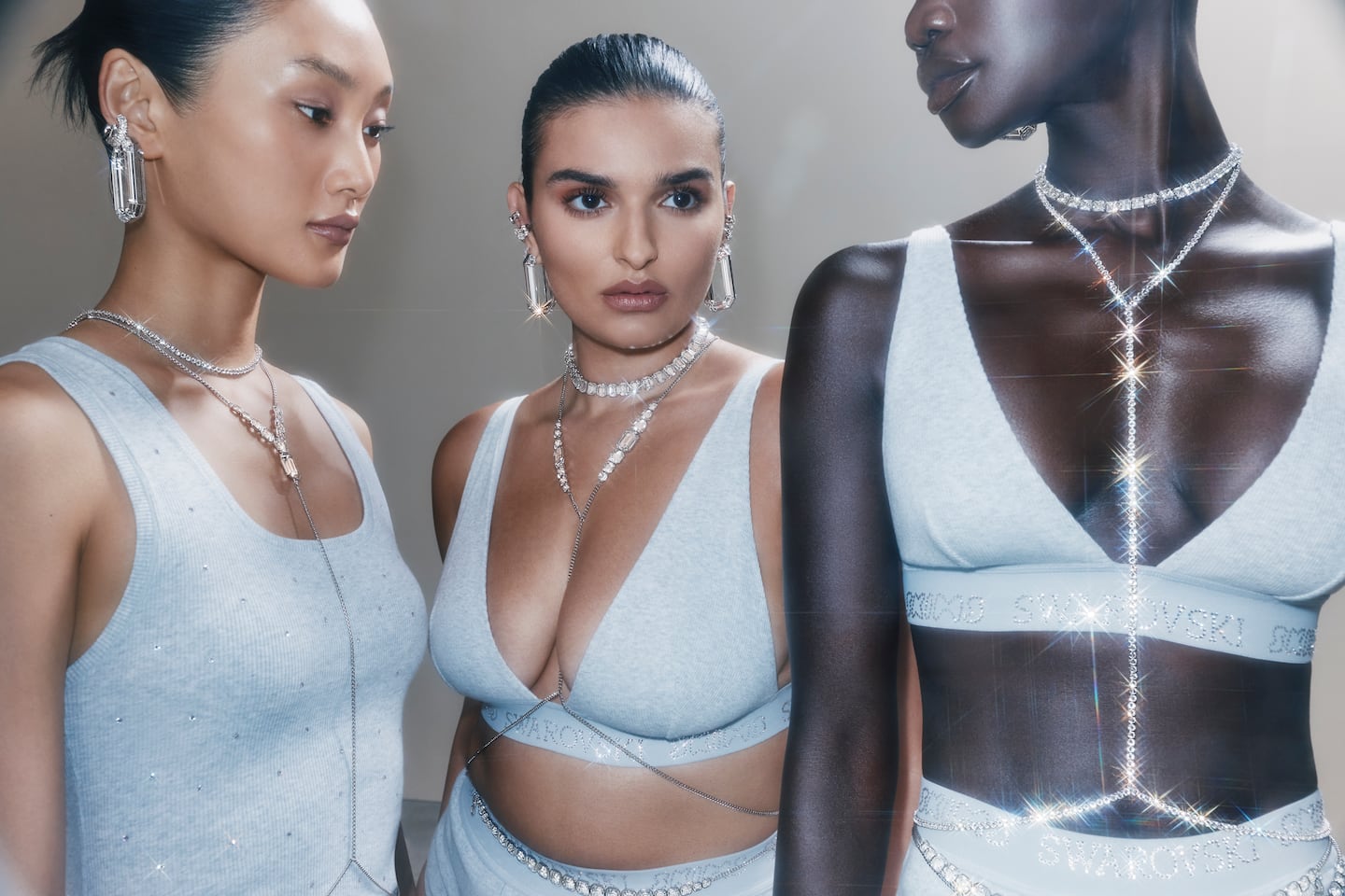 Three models pose in Skims underwear and Swarovski body jewellery.