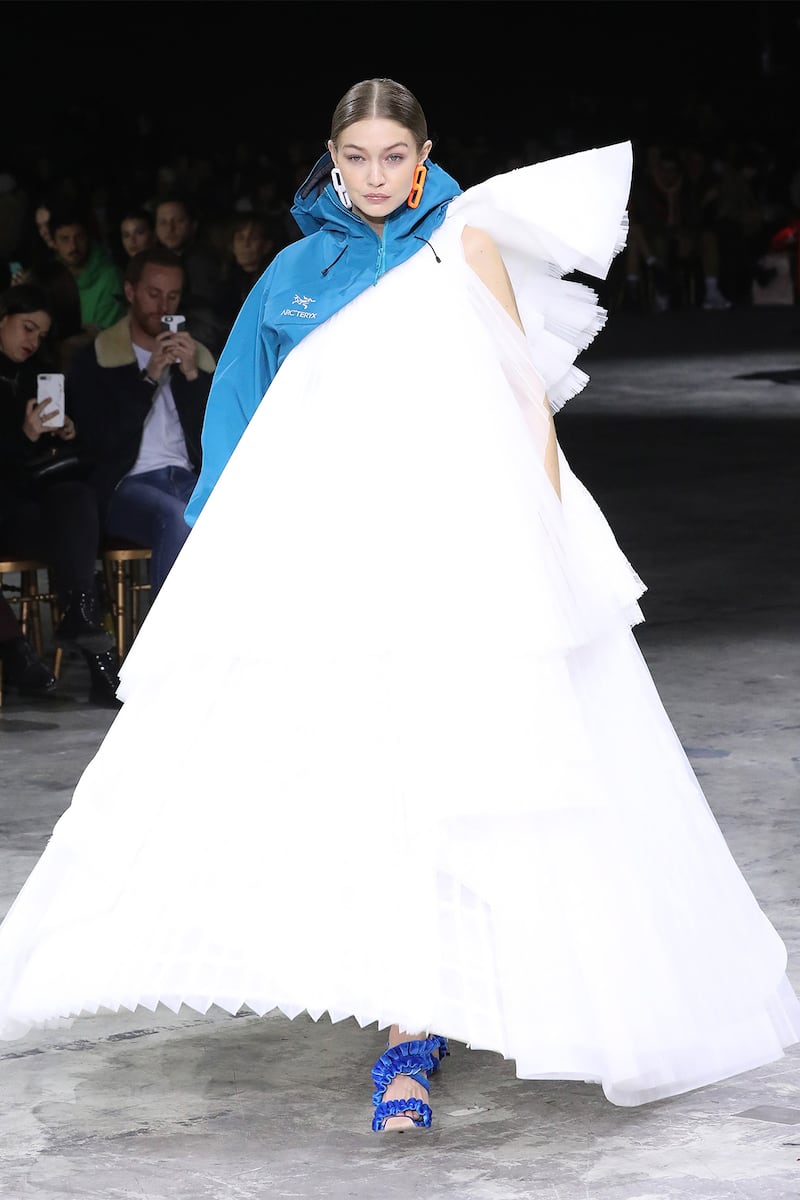 Gigi Hadid in a ball gown fused with an Arc'teryx jacket at Off-White’s Autumn/Winter 2020 Women’s Ready-to-Wear show.