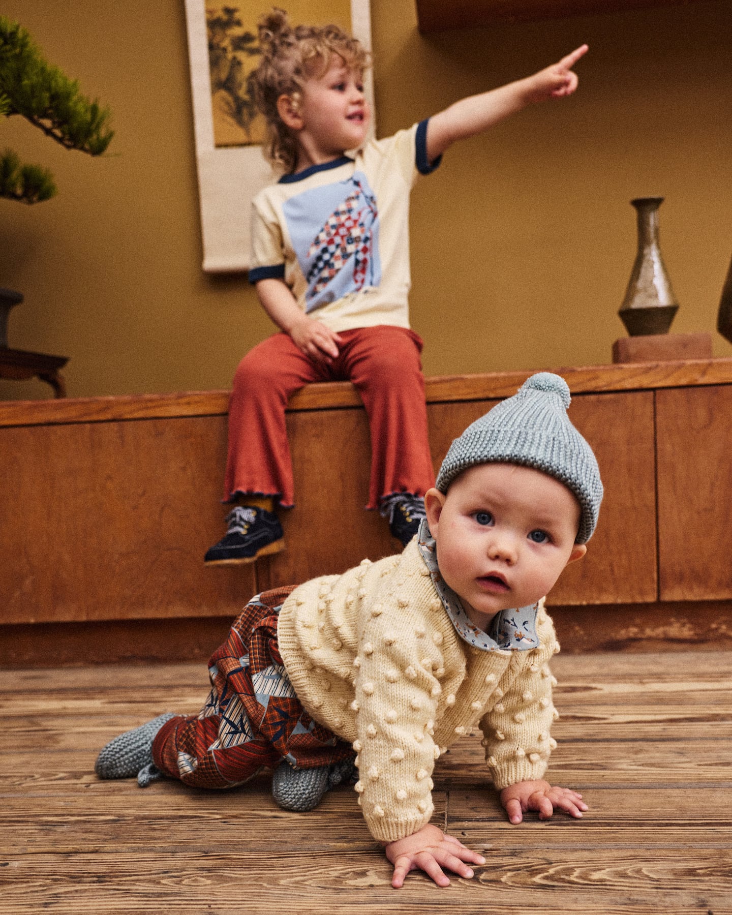 A baby and boy wearing Misha & Puff.