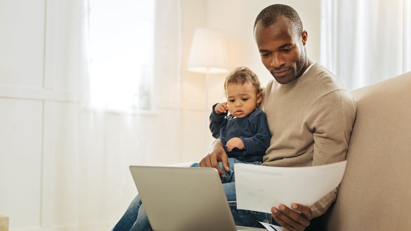 A parent with their child working from home during the lockdown.